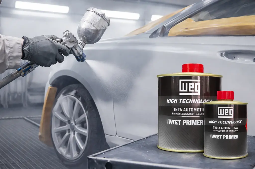 Automotive primer application in paint booth.webp